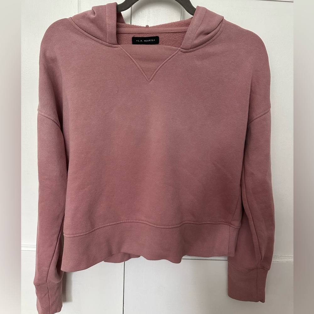 slightly cropped and about waist length sweatshirt